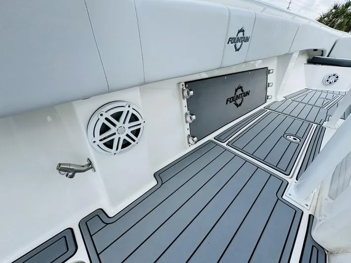  Yacht Photos Pics 2020 Fountain 38cc boat interior with gray cushioned seating and deck.