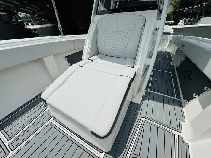 Yacht Photos Pics 2020 Fountain 38cc boat with luxurious white seating and gray deck.