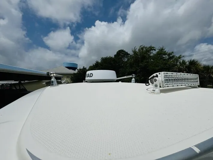  Yacht Photos Pics Top view of a 2020 Fountain 38cc boat under a partly cloudy sky.
