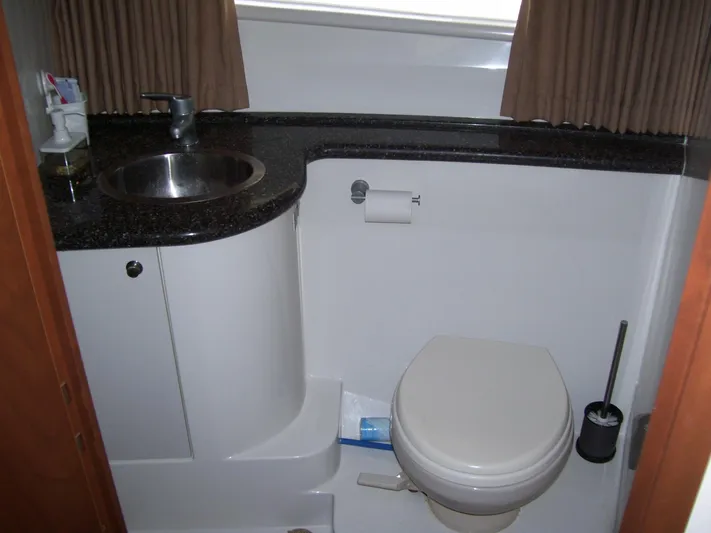  Yacht Photos Pics Bathroom interior of 2007 Carver 43 Motor Yacht with sink and toilet.