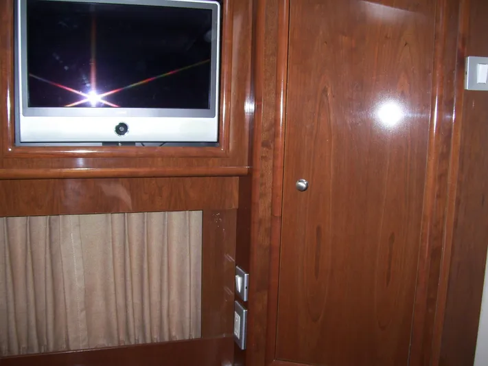 Yacht Photos Pics Interior of 2007 Carver 43 Motor Yacht with TV and wooden cabinetry.