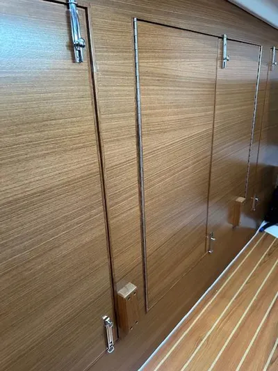 C426 #115 Yacht Photos Pics Wooden interior paneling with metal latches on a 2025 Catalina 426 model.