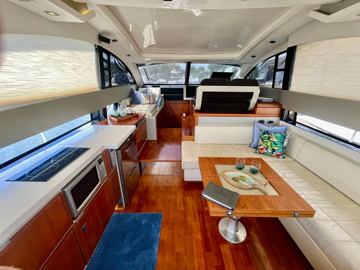  Yacht Photos Pics Luxurious interior of 2013 Fairline Targa 50 GT yacht with modern kitchen and seating area.