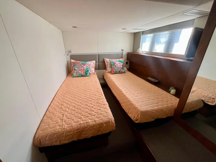  Yacht Photos Pics Twin cabin in 2013 Fairline Targa 50 GT yacht with beige bedding and colorful pillows.