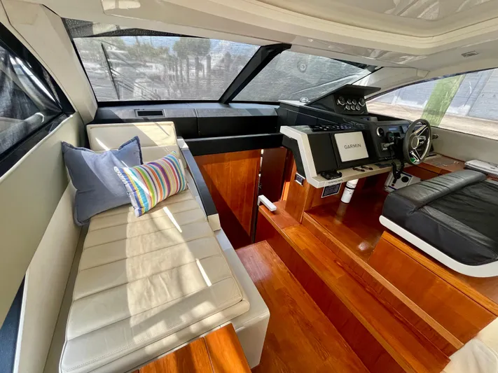  Yacht Photos Pics Interior of 2013 Fairline Targa 50 GT yacht with plush seating and modern helm.