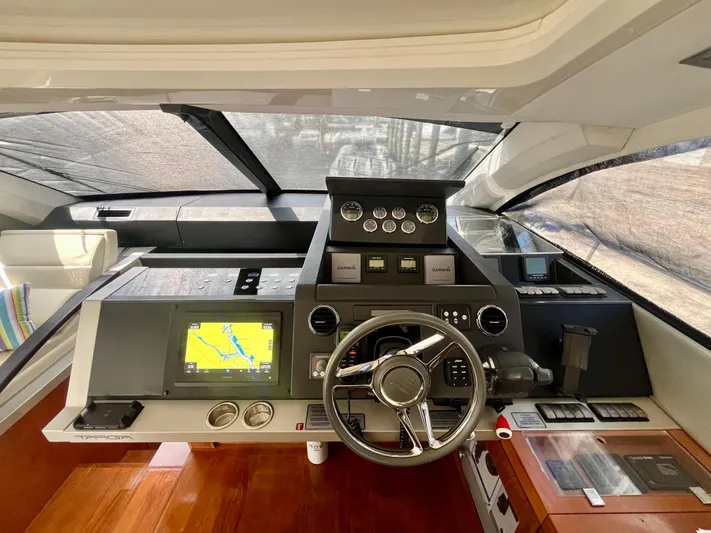  Yacht Photos Pics Cockpit of 2013 Fairline Targa 50 GT yacht with navigation system and steering wheel.