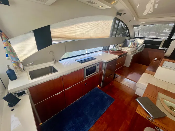  Yacht Photos Pics Interior of 2013 Fairline Targa 50 GT yacht with modern kitchen and seating area.