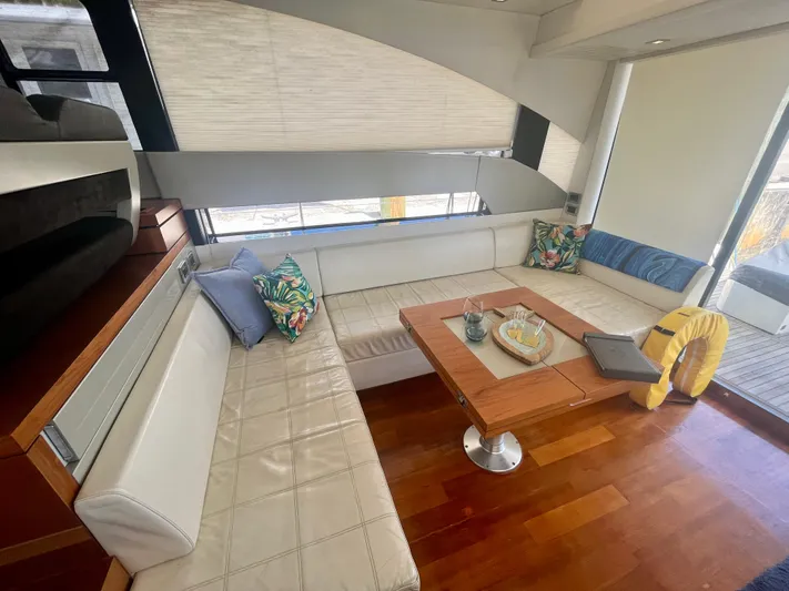  Yacht Photos Pics Luxurious interior of 2013 Fairline Targa 50 GT yacht with elegant seating and wooden table.