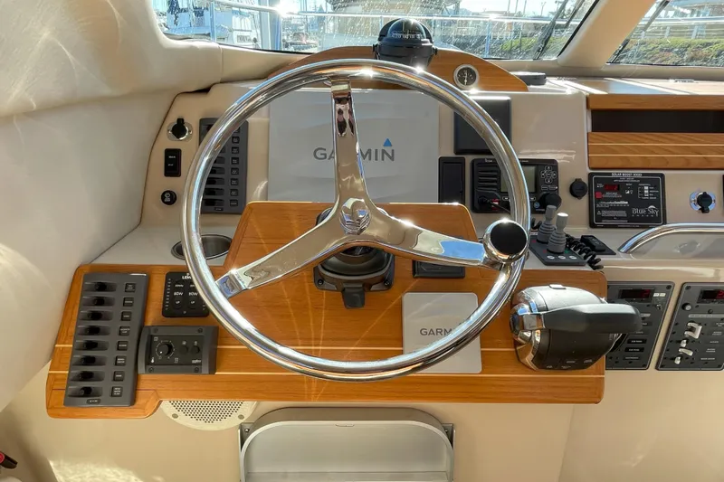Sweet Jane Yacht Photos Pics Steering wheel and controls of a 2015 Aspen C100 boat cockpit.