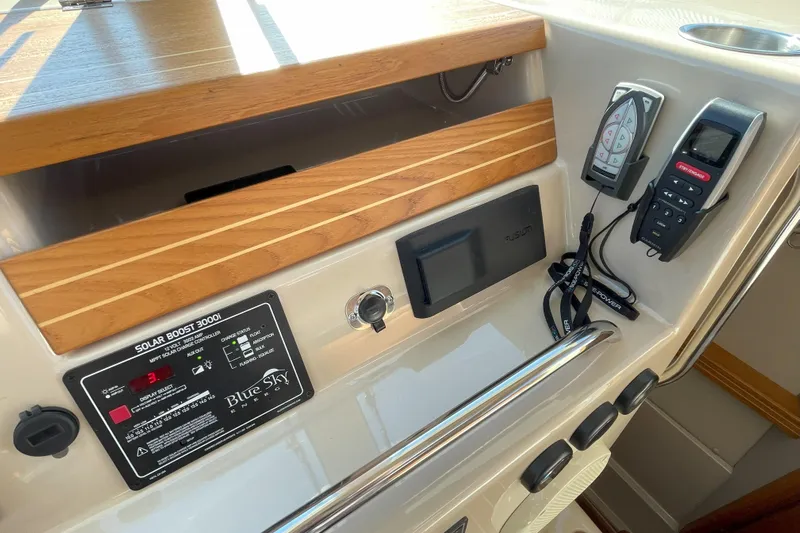 Sweet Jane Yacht Photos Pics Control panel of 2015 Aspen C100 boat with solar boost and navigation equipment.
