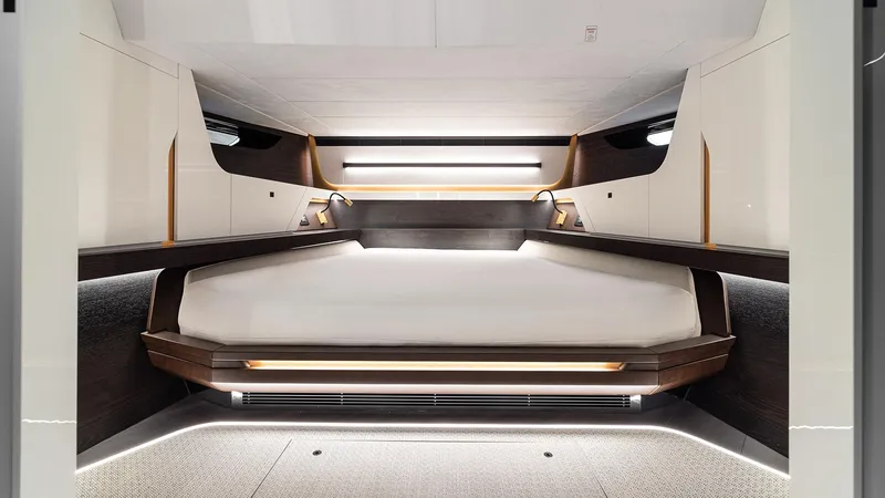 Chapter 3 Yacht Photos Pics Luxurious interior cabin of 2024 Vanquish Yachts VQ70, featuring modern design and ambient lighting.