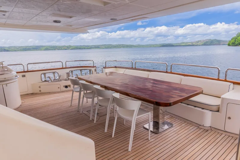 Camy Ed Yacht Photos Pics Luxury yacht Azimut 105 Grande 2006, featuring elegant deck seating and scenic ocean view.