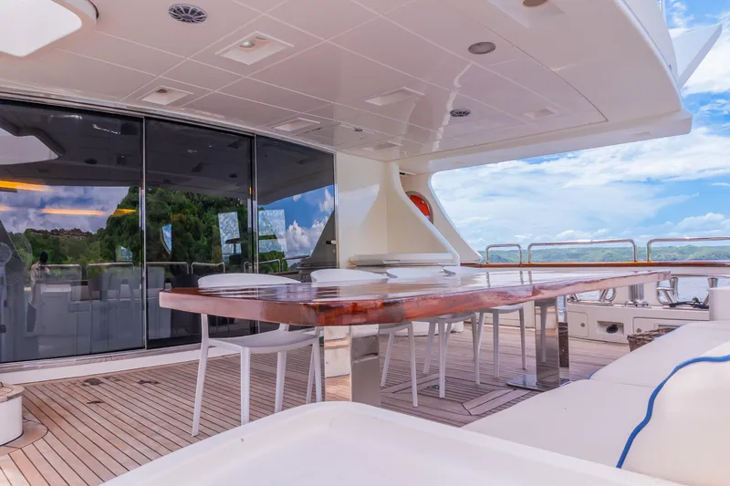 Camy Ed Yacht Photos Pics Luxurious deck of 2006 Azimut 105 Grande yacht with elegant dining area.
