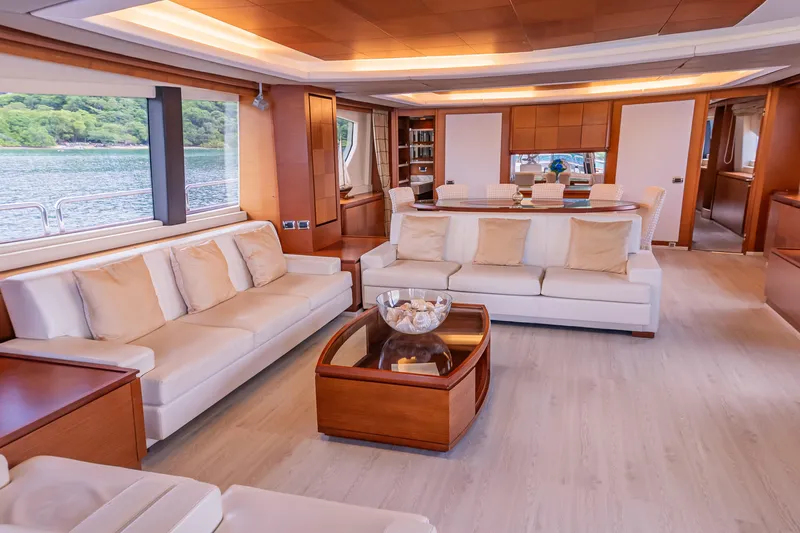 Camy Ed Yacht Photos Pics Luxurious interior of 2006 Azimut 105 Grande yacht with elegant seating and dining area.