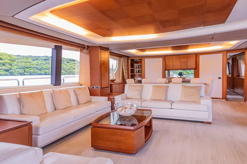 Camy Ed Yacht Photos Pics Luxurious interior of 2006 Azimut 105 Grande yacht with elegant seating and scenic views.