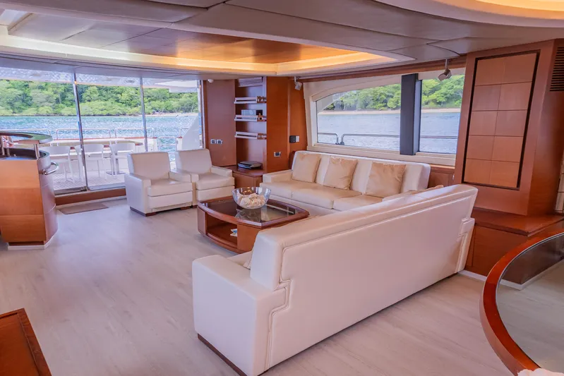 Camy Ed Yacht Photos Pics Luxurious interior of 2006 Azimut 105 Grande yacht with elegant seating and scenic views.