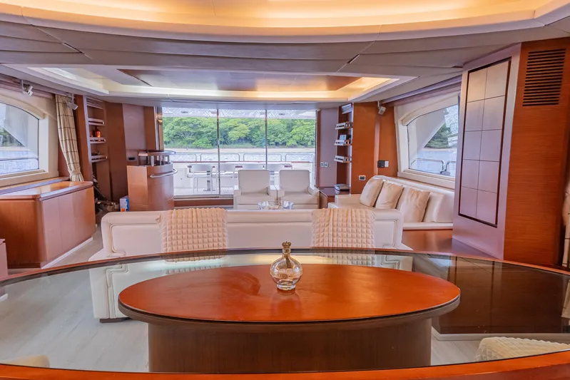 Camy Ed Yacht Photos Pics Luxurious interior of 2006 Azimut 105 Grande yacht with elegant furnishings and panoramic windows.