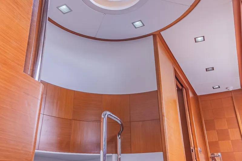 Camy Ed Yacht Photos Pics Interior of 2006 Azimut 105 Grande yacht with modern wood paneling and sleek design.