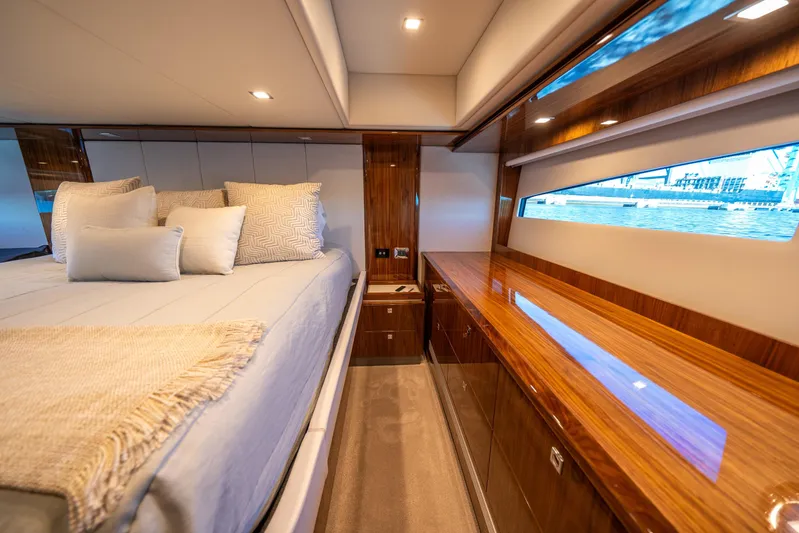 Water Dog Yacht Photos Pics Luxurious interior of 2024 Riviera 5400 Sport Yacht with elegant wood finishes.