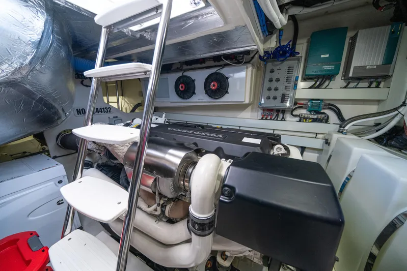 Water Dog Yacht Photos Pics Engine room of 2024 Riviera 5400 Sport Yacht with advanced machinery and control systems.