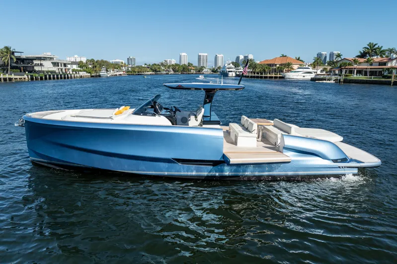  Yacht Photos Pics 2025 Solaris Power 44 Open yacht cruising on a sunny day in a scenic waterway.