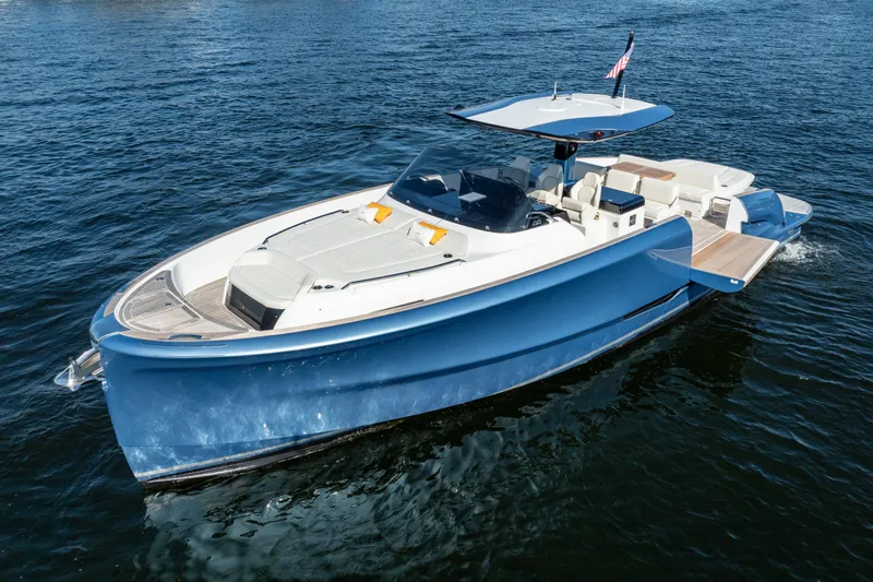  Yacht Photos Pics 2025 Solaris Power 44 Open yacht cruising on blue water, showcasing sleek design and luxury features.