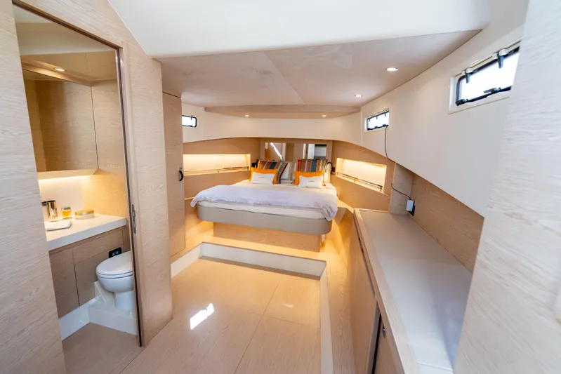  Yacht Photos Pics Luxurious interior of 2025 Solaris Power 44 Open yacht with modern bedroom and bathroom.