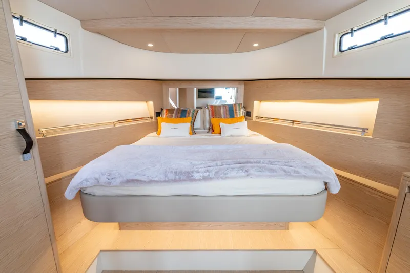  Yacht Photos Pics Luxurious interior cabin of 2025 Solaris Power 44 Open yacht, featuring a cozy bed and modern design.