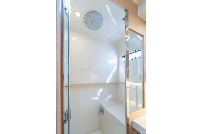  Yacht Photos Pics Modern shower area in 2025 Solaris Power 44 Open yacht, featuring sleek design and natural lighting.