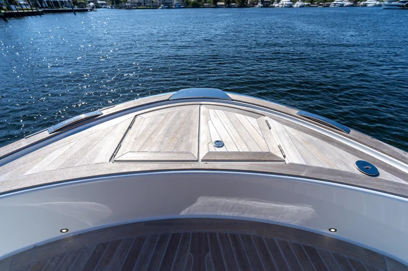  Yacht Photos Pics Bow view of 2025 Solaris Power 44 Open yacht on calm water.