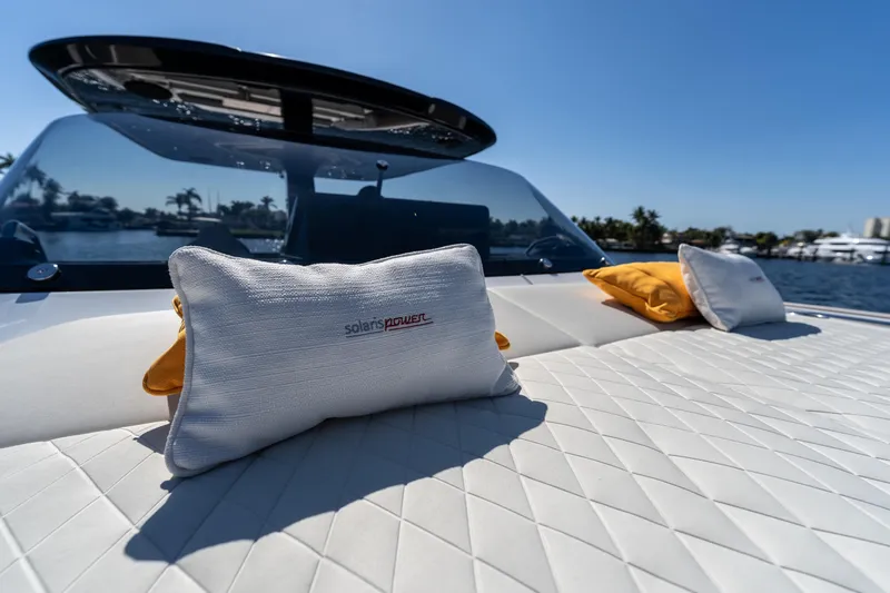  Yacht Photos Pics Luxurious Solaris Power 44 Open yacht interior with cushions, 2025 model, on a sunny day.
