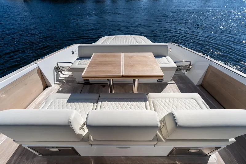  Yacht Photos Pics Luxurious seating area on the 2025 Solaris Power 44 Open yacht, overlooking serene waters.