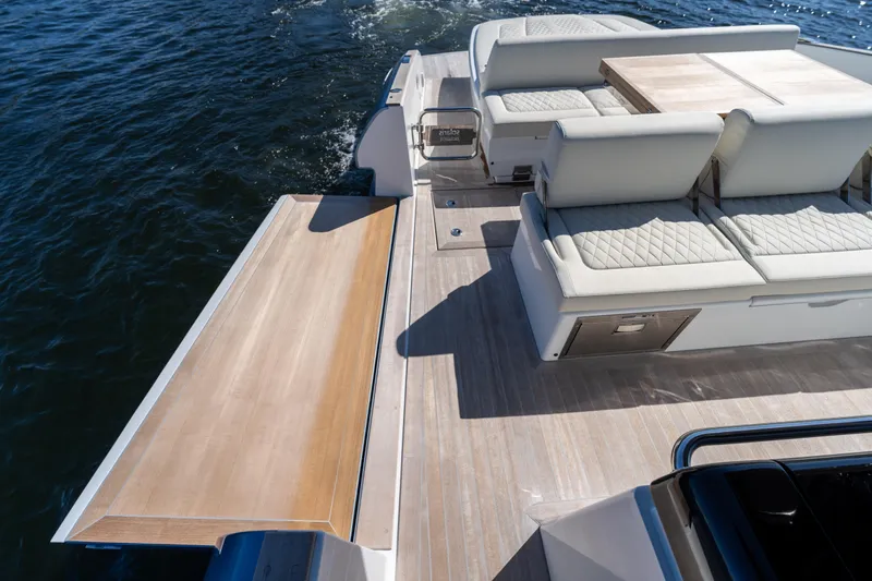  Yacht Photos Pics 2025 Solaris Power 44 Open yacht with luxurious seating and extended deck on the water.