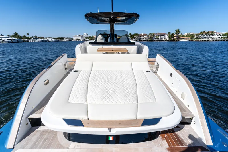  Yacht Photos Pics 2025 Solaris Power 44 Open yacht with luxurious sunbed on calm water.