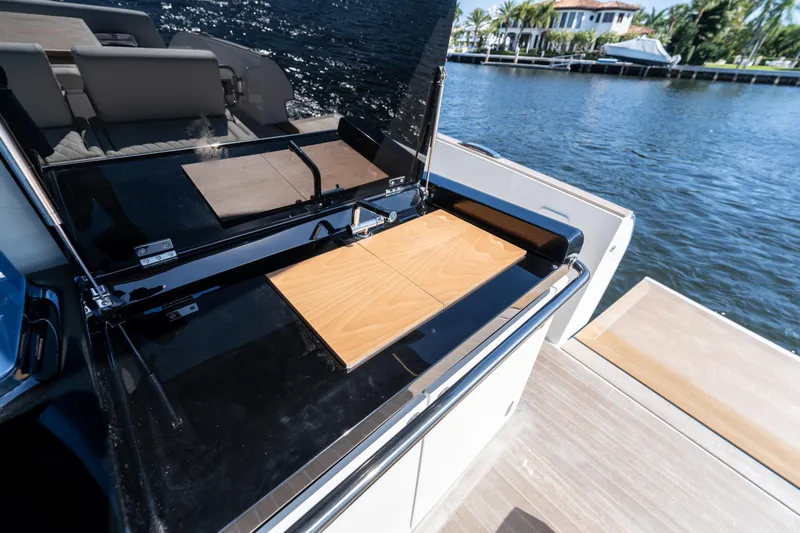  Yacht Photos Pics 2025 Solaris Power 44 Open yacht with sleek outdoor kitchen by the water.