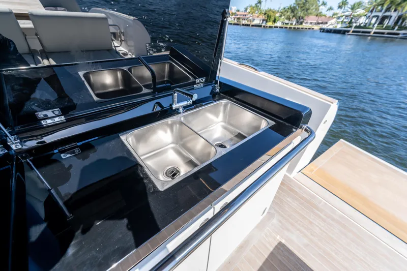 Yacht Photos Pics Luxury yacht Solaris Power 44 Open 2025 with sleek outdoor kitchen and dual sinks.