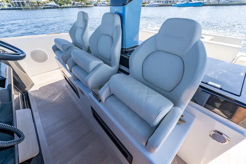  Yacht Photos Pics Luxurious seating on 2025 Solaris Power 44 Open yacht, overlooking serene waters.