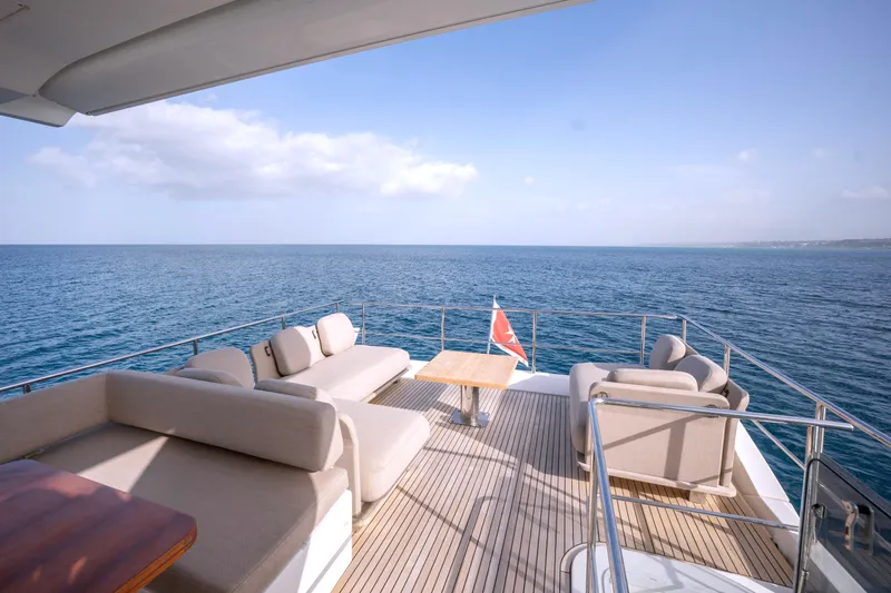 M/y Golden Pearl Yacht Photos Pics Luxurious 2017 Azimut yacht deck with elegant seating, overlooking serene ocean view.
