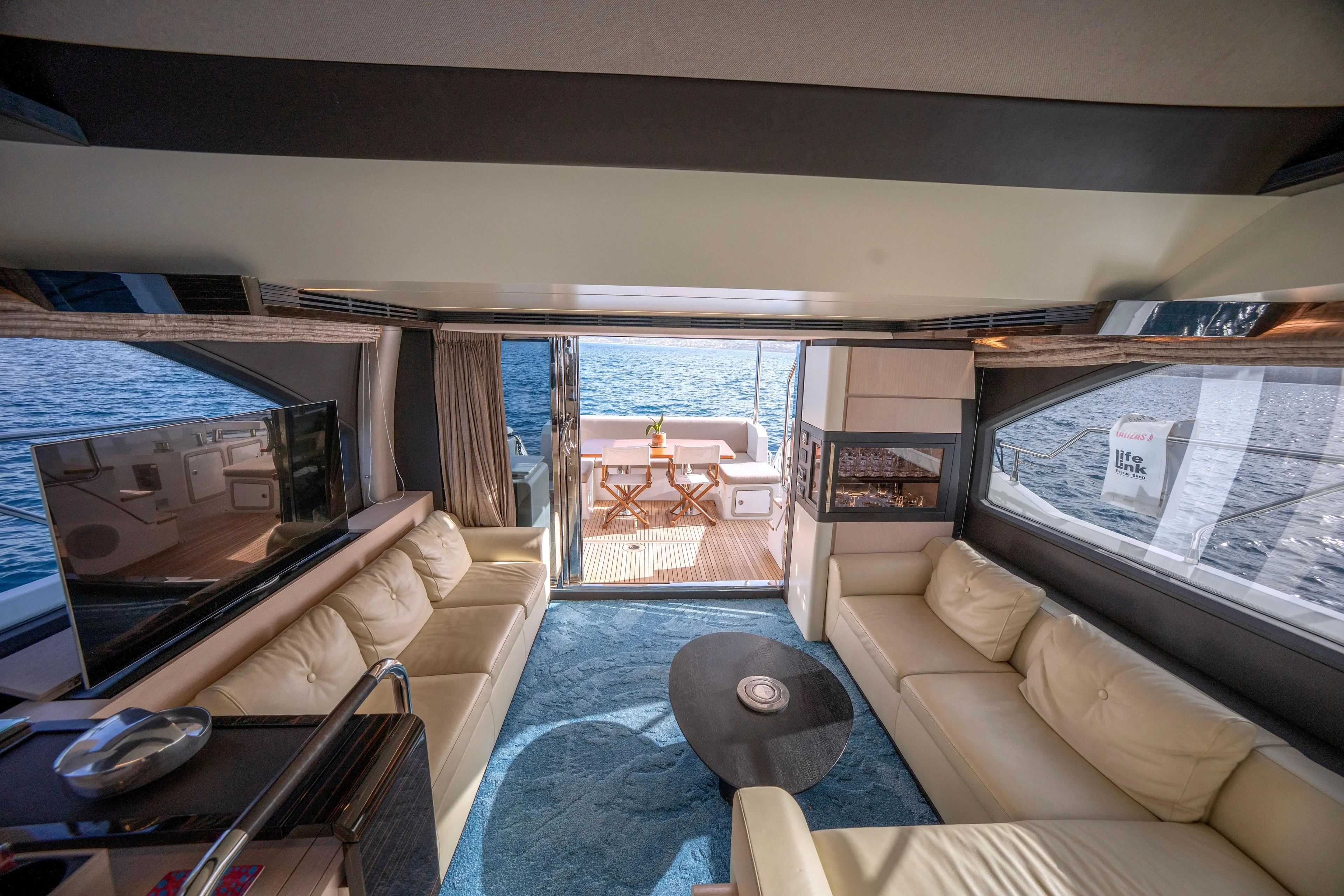 M/y Golden Pearl Yacht Photos Pics Luxurious 2017 Azimut yacht interior with elegant seating, TV, and ocean view.