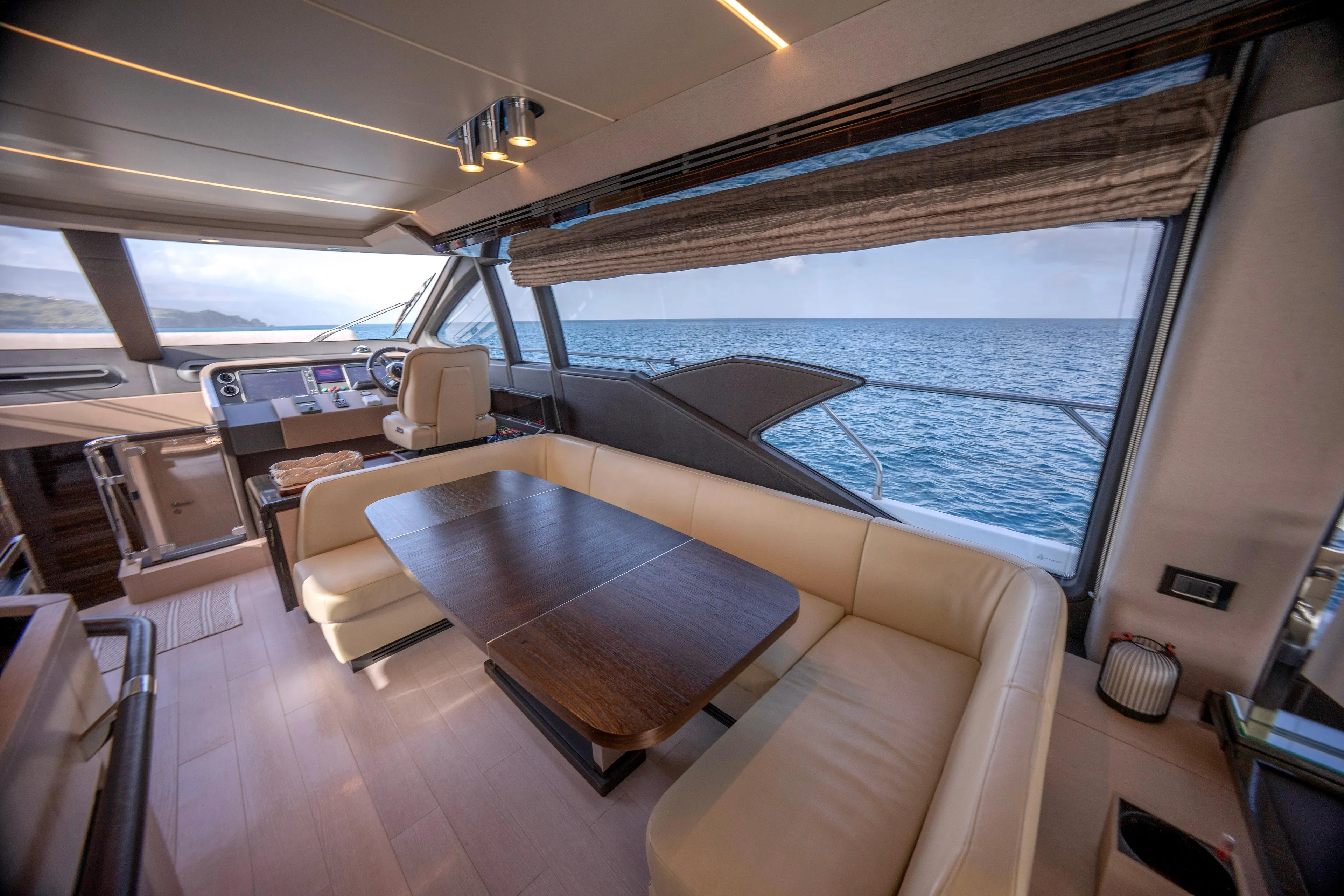 M/y Golden Pearl Yacht Photos Pics Luxurious 2017 Azimut yacht interior with ocean view, featuring elegant seating and modern helm.