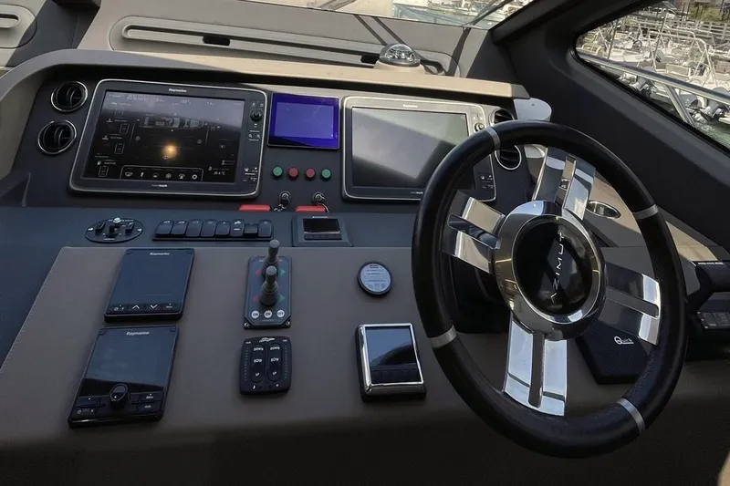 M/y Golden Pearl Yacht Photos Pics Cockpit of a 2017 Azimut yacht with advanced navigation controls and steering wheel.
