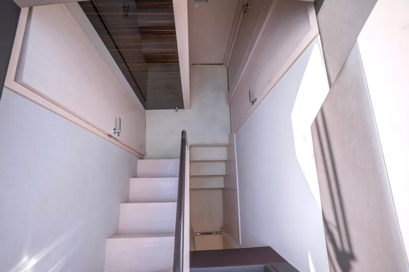 M/y Golden Pearl Yacht Photos Pics Staircase inside 2017 Azimut yacht with modern, sleek design and light wood finish.
