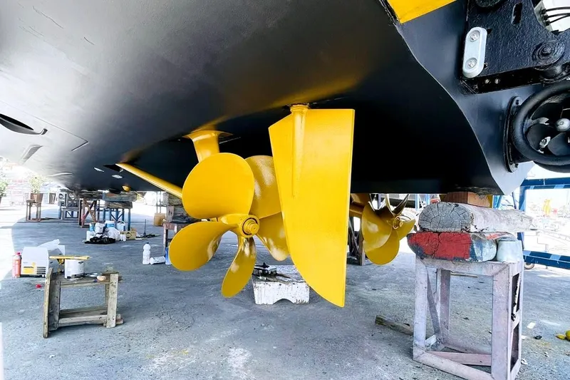 M/y Golden Pearl Yacht Photos Pics Yellow propeller of a 2017 Azimut yacht under maintenance in a shipyard.