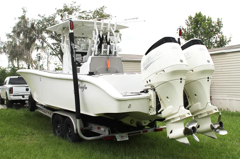  Yacht Photos Pics 2005 Yellowfin 31 Open boat with dual Suzuki outboard engines on a trailer.