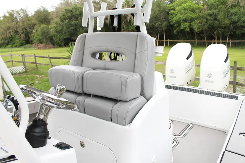  Yacht Photos Pics 2005 Yellowfin 31 Open boat interior with gray seating and dual Suzuki engines.