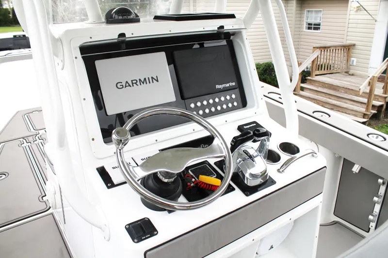  Yacht Photos Pics 2005 Yellowfin 31 Open boat console with Garmin and Raymarine navigation systems.