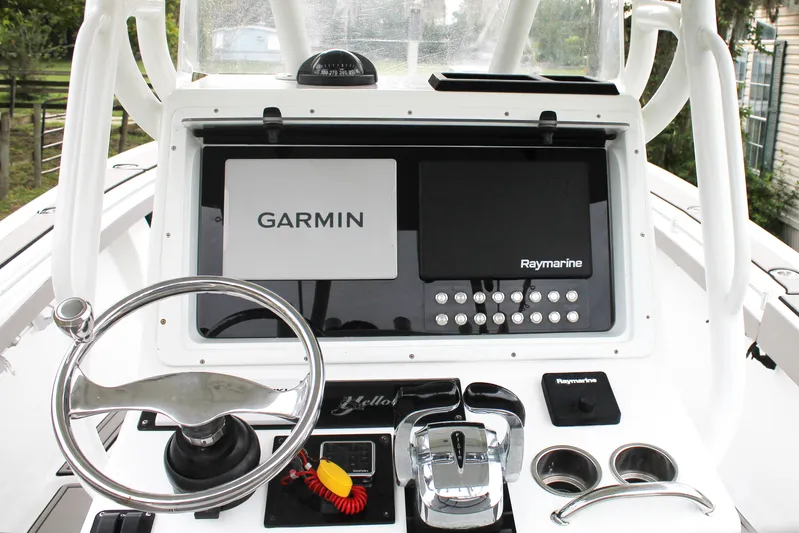  Yacht Photos Pics 2005 Yellowfin 31 Open boat dashboard with Garmin and Raymarine navigation systems.