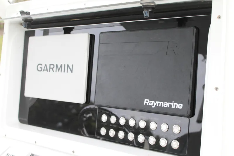  Yacht Photos Pics Garmin and Raymarine navigation systems on 2005 Yellowfin 31 Open boat dashboard.