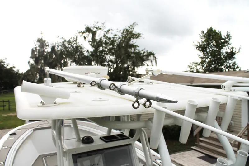  Yacht Photos Pics 2005 Yellowfin 31 Open boat with fishing rod holders and equipment on deck.