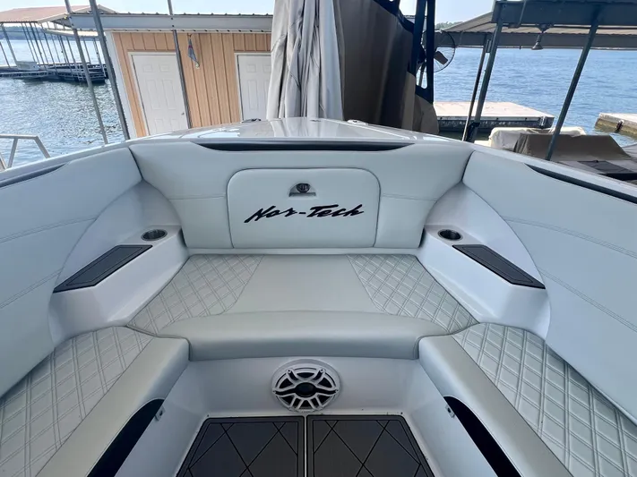  Yacht Photos Pics 2023 Nor-Tech 340 Sport Center Console interior with white seating and diamond stitching.